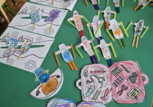 Prace dzieci - narciarz , saneczkowe wyścigi, apteczka przy zabawach zimowych.