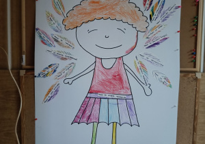 Plakat przedstawiający dziewczynkę ze skrzydłami z piór i napisem "Mam prawa - to uskrzydla"